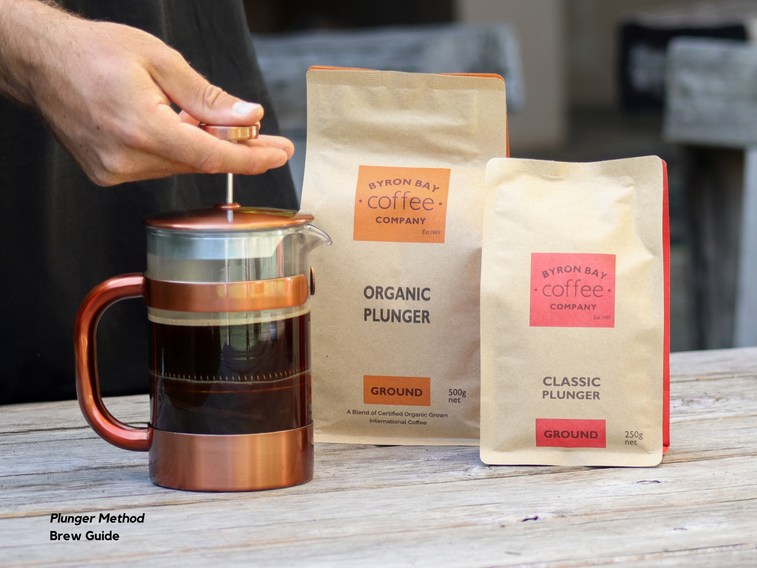 Pressing filter on plunger to brew coffee