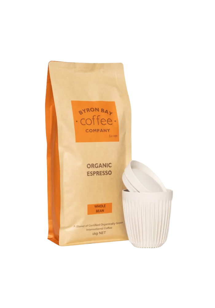 A bag of 1kg Organic Coffee next to a White Huskee Keep Cup