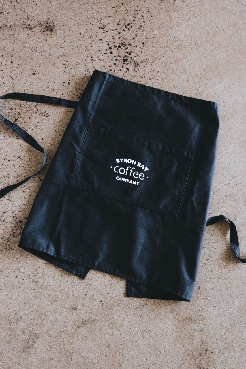 Flat lay of Byron Bay Coffee Co apron