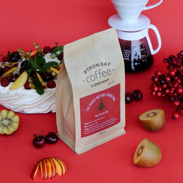 Bag of Christmas Blend next to kiwis, a pavlova., cherries and nectarines